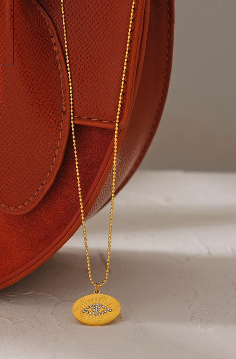 Gold evil eye circle necklace