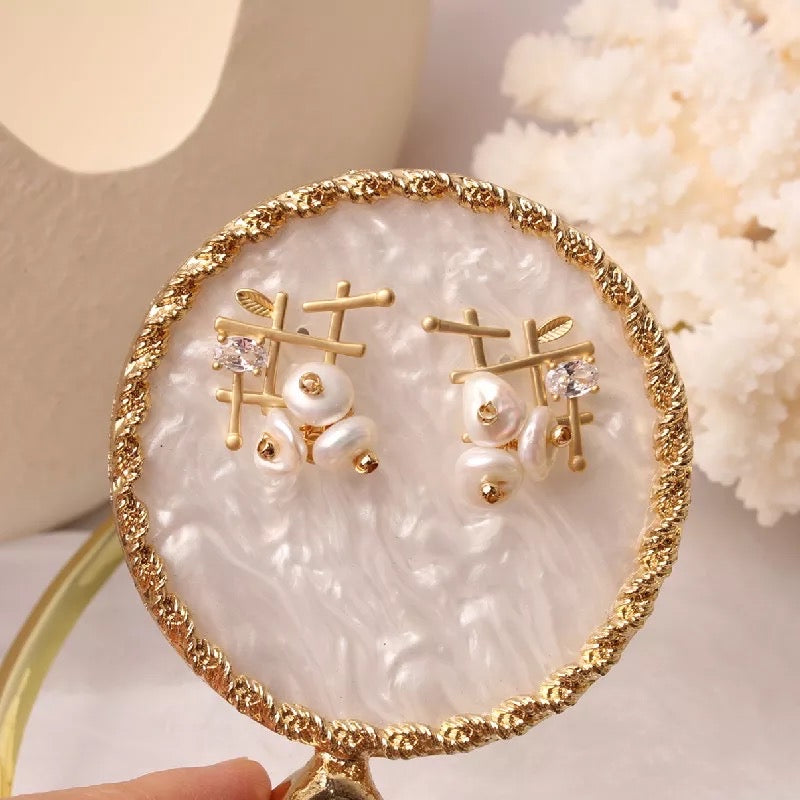 Gold pearl earrings