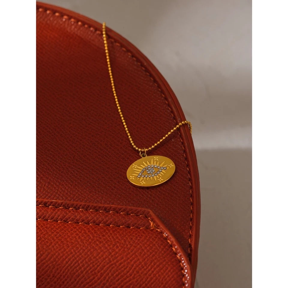 Gold evil eye circle necklace