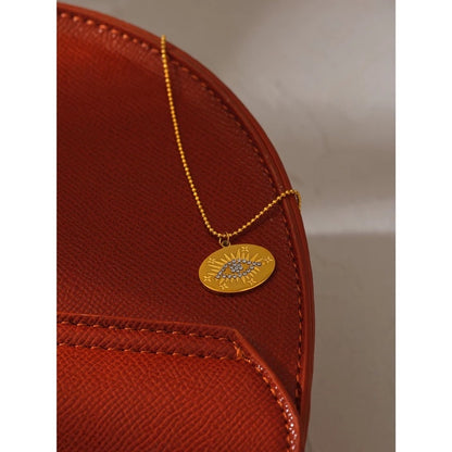 Gold evil eye circle necklace