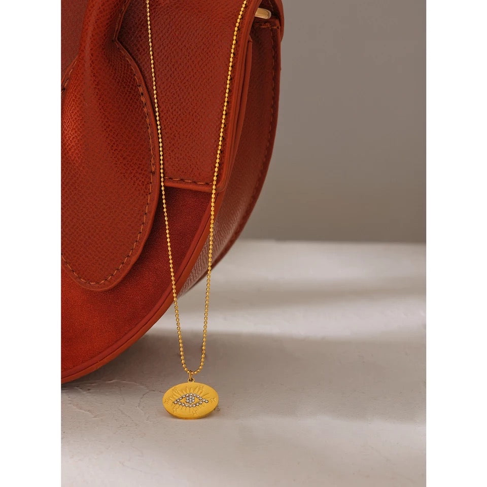 Gold evil eye circle necklace