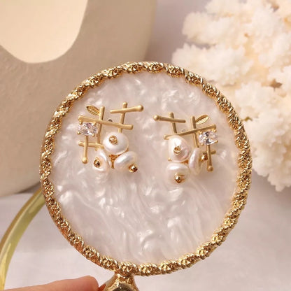 Gold pearl earrings